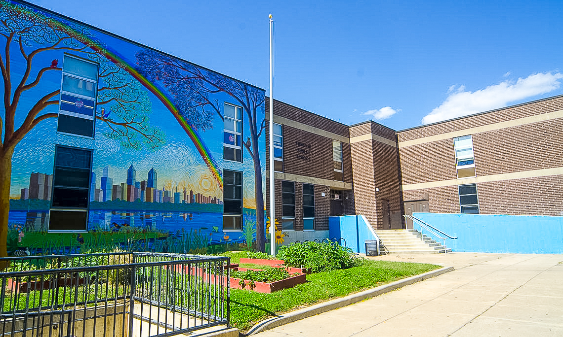 Exterior of Penrose School with Mural Front view of Penrose School with rainbow mural and entrance steps